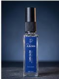Perfume bottle labeled 'Luna Glow' by AKSS on a dark background